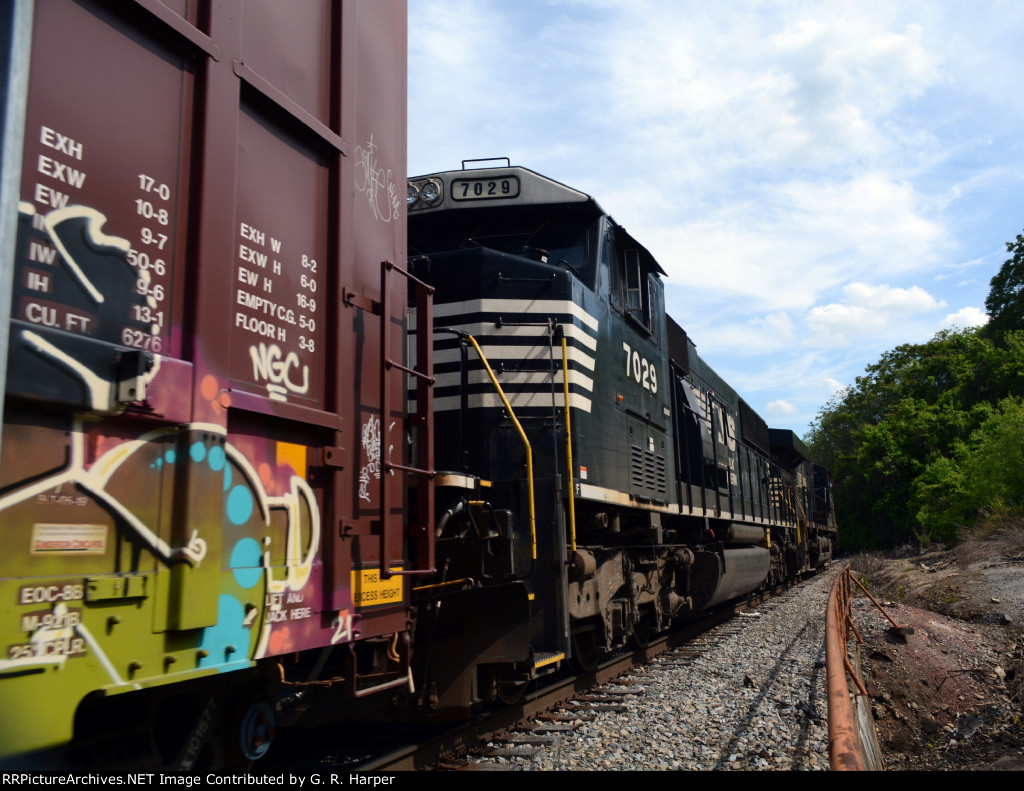 NS yard job E19 climbs the grade with cars from CSX.